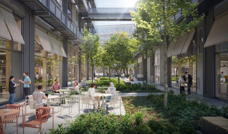 Outdoor seating area with tables and chairs, trees, plants, and a walkway