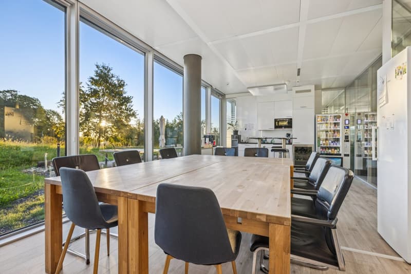 conference room, large windows, large table, chairs, modern kitchen