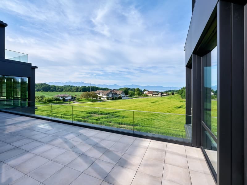 Balcony with glass railing, tile floor, wide view of countryside, glass walls