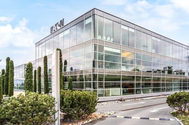modern office building, glass facade, multiple floors, large windows, modern architecture, exterior