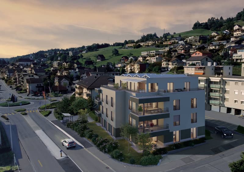 Modern apartment building with multiple floors, balconies, and a rooftop terrace.