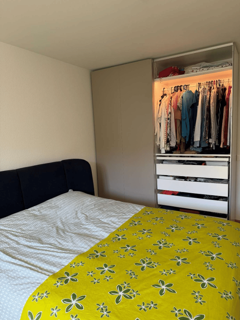 Bedroom with bed, wardrobe, and drawers