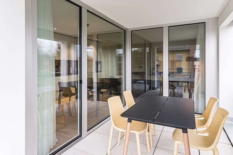 modern dining room, table, chairs, glass wall, wood floor, view