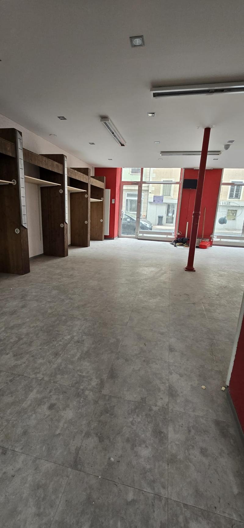 empty room, grey tiles, built-in wardrobes, glass doors, two long shelves, red walls