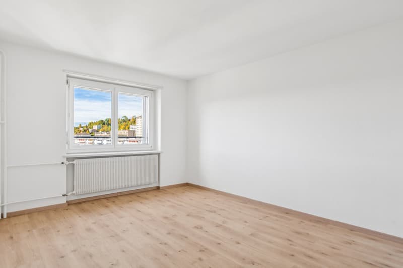 empty room, wooden floor, white walls, large window with view