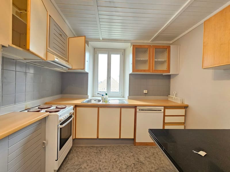 kitchen, stove, sink, dishwasher, cabinets, white walls, carpet