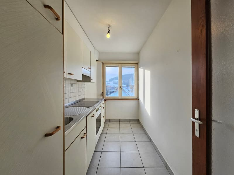 modern, white cabinets, tiled floor, large window, sink, oven, view of outside landscape