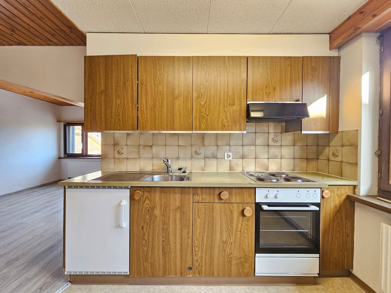 kitchen with wooden cabinets, tiled backsplash, gas stove, sink, dishwasher, electric oven