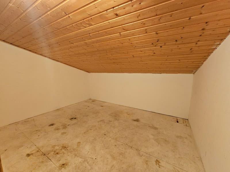 empty room with wooden ceiling, white walls, and concrete floor