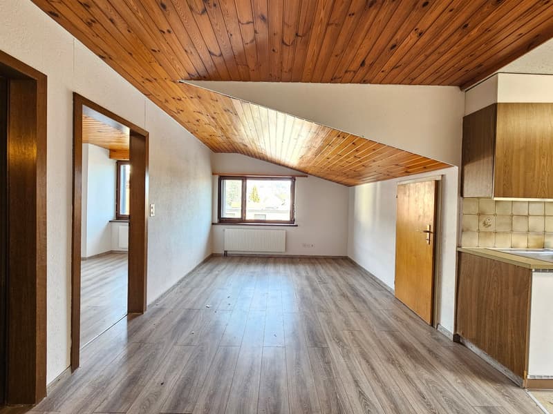 empty room, wooden floor, white walls, wooden ceiling, two windows, two doors