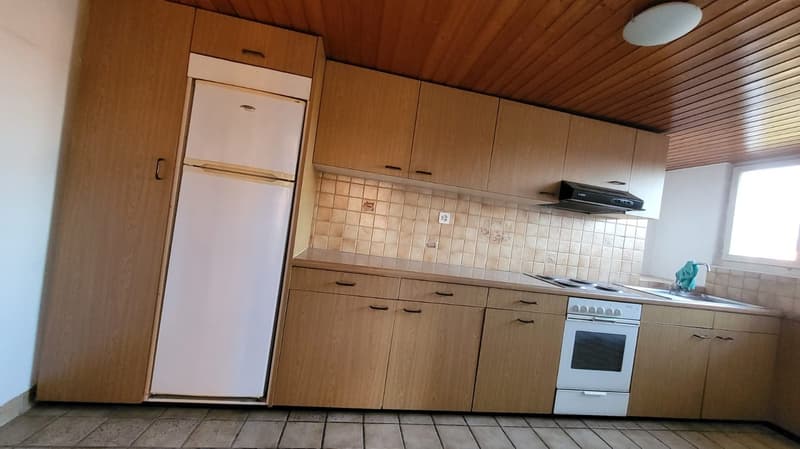 kitchen with gas stove, oven, sink, refrigerator, washing machine, dishwasher, cabinets, tile flooring