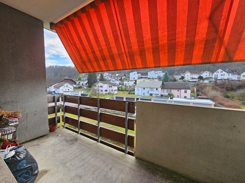 balcony, metal railing, red awning, garbage cans, view of the houses and surrounding area