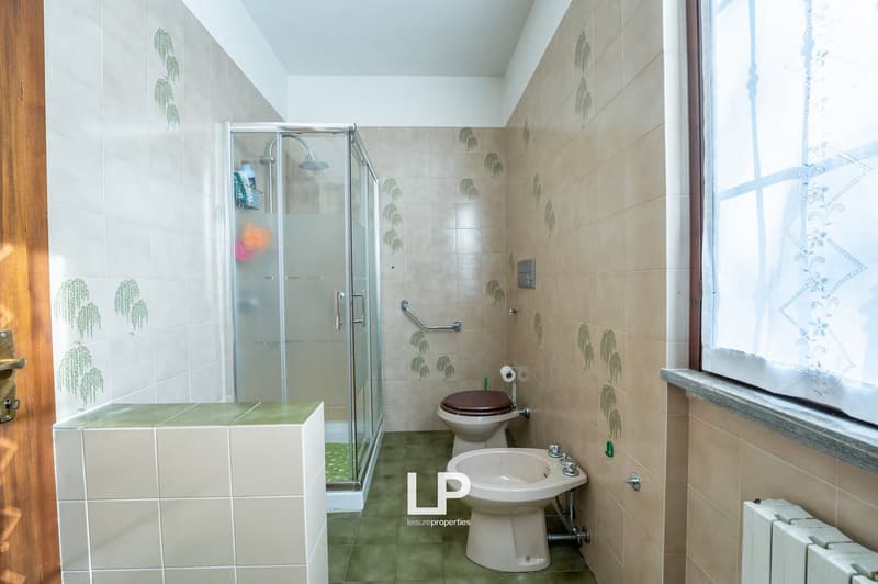 shower, toilet, bidet, radiator, window, tiles