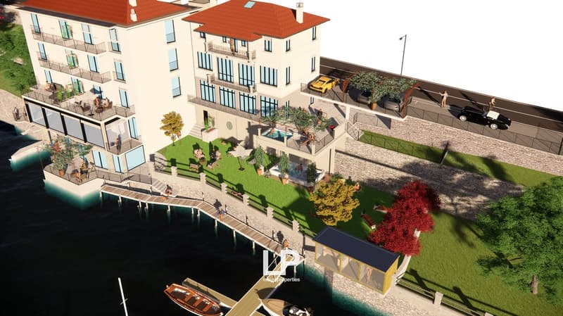 A multi-story building with balconies, a swimming pool, a car park, a dock, a road, and several cars.