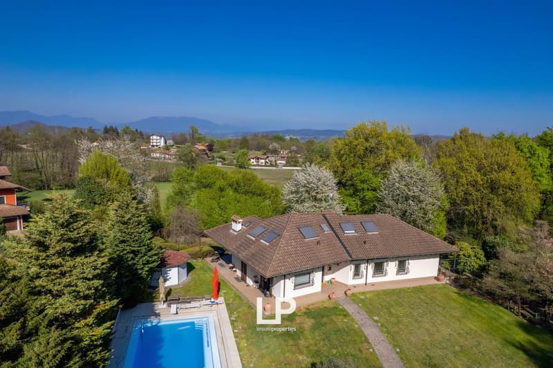 single-family house, 3 floors, brown roof, white walls, solar panels, swimming pool, garden