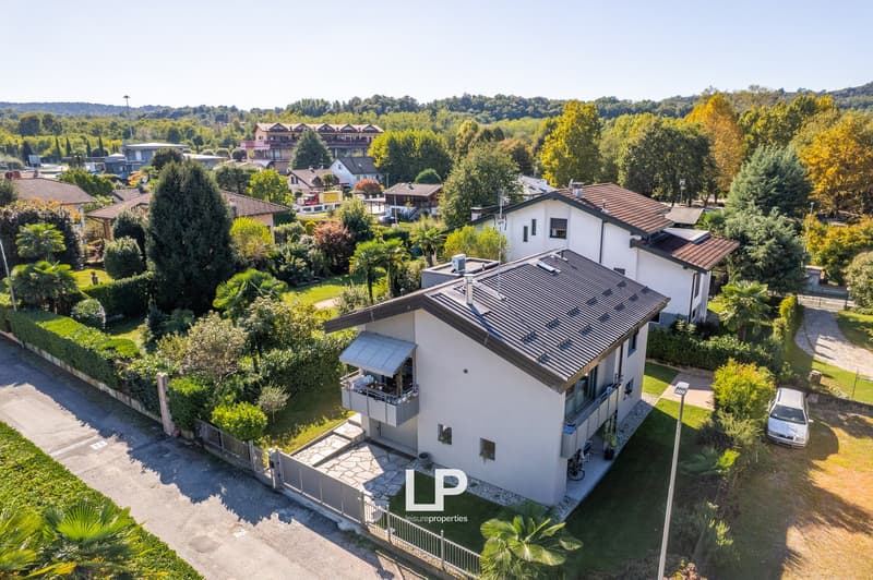 two-storey house, balcony, parking place, garden, trees