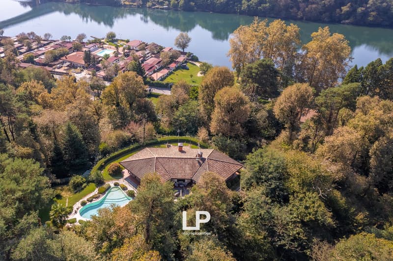 Luxury villa near lake, swimming pool, green area, close to other houses, greenery