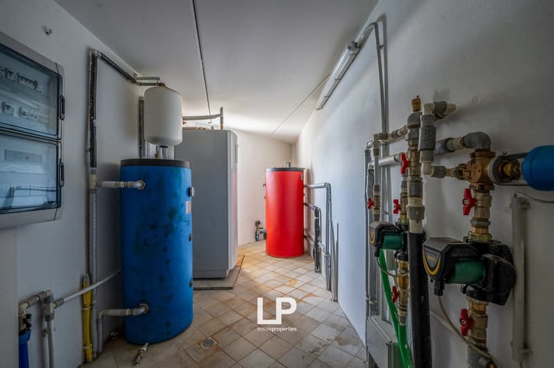 Boilers, pipes, meters, tiled floor