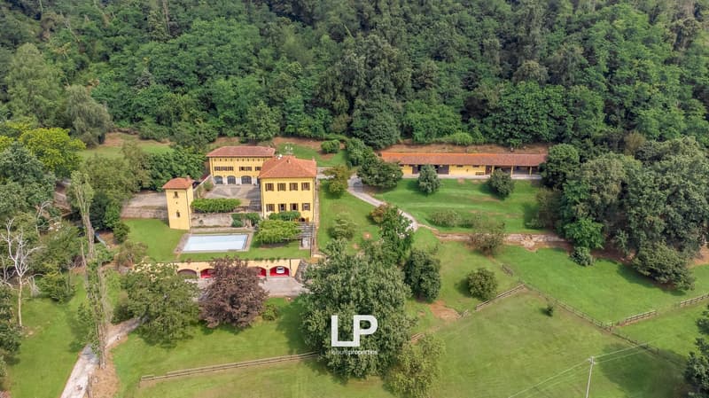 large yellow villa, swimming pool, garages, large green grounds