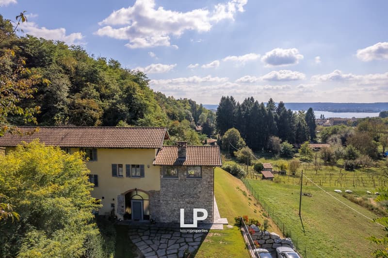 Detached villa, stone facade, large terrace, scenic landscape, lake view
