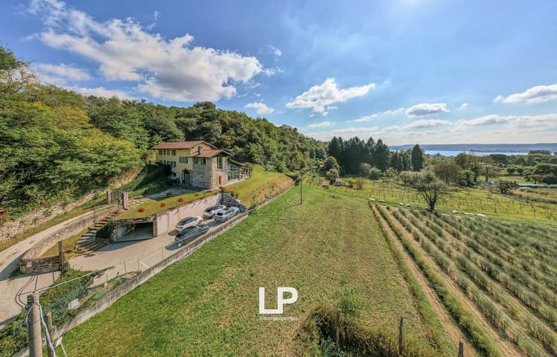 Raised ground floor, red brick house, terrace, garage, lake view, landscaped garden