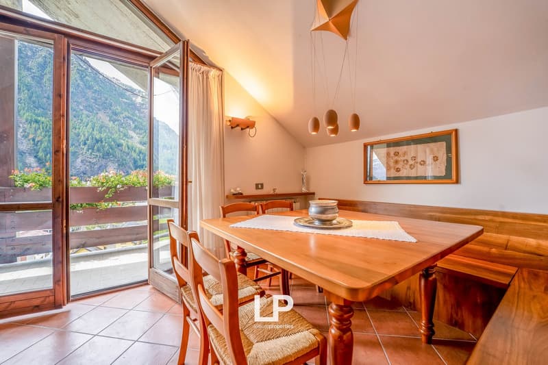 dining area, large windows, balcony, dining table, mountain view