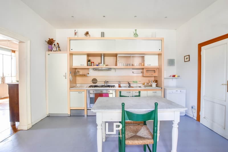 kitchen with a table, chairs, oven, dishwasher, cabinets, countertop, sink, refrigerator