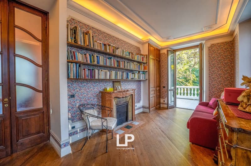 wooden floor, fireplace, chair, bookshelf, balcony