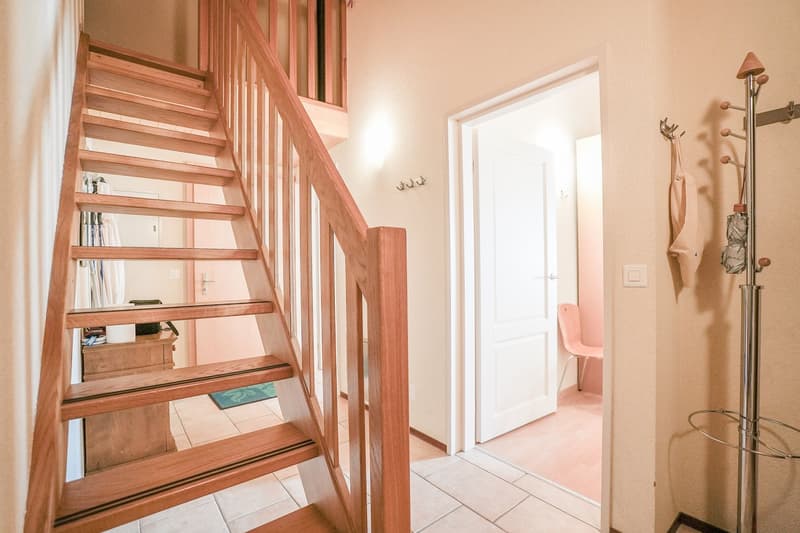 Entrance hall with stairs and coat rack
