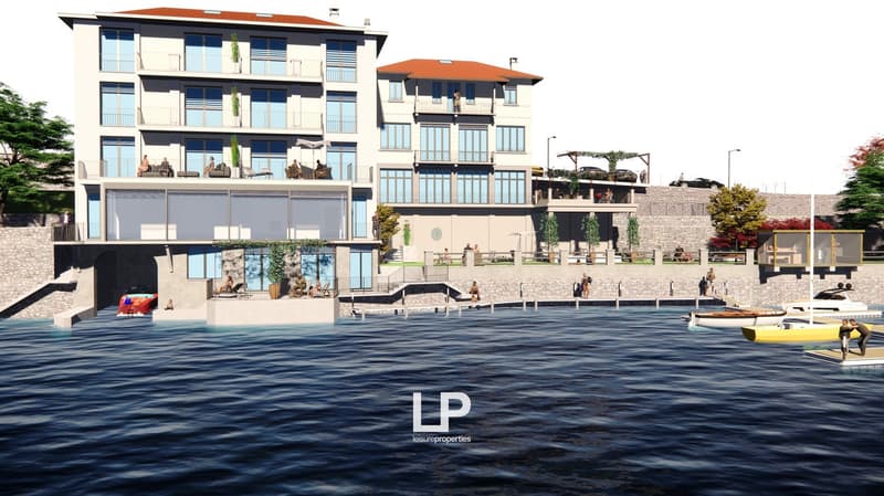 Buildings include multiple balconies, windows, a pool, parking, and boats