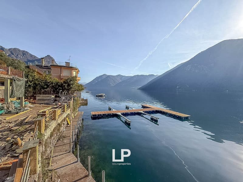Lake view house, docked wooden pier, mountains, waterfront