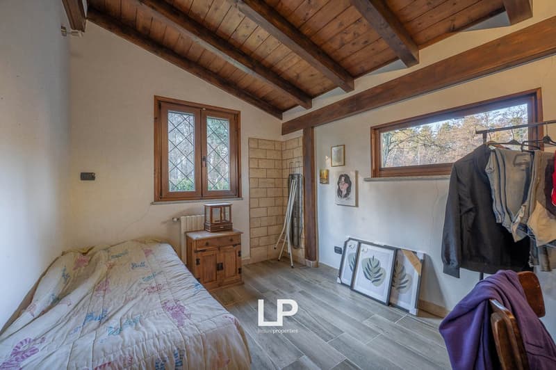 bed, wooden cabinet, wooden beams ceiling, windows, tiled floor