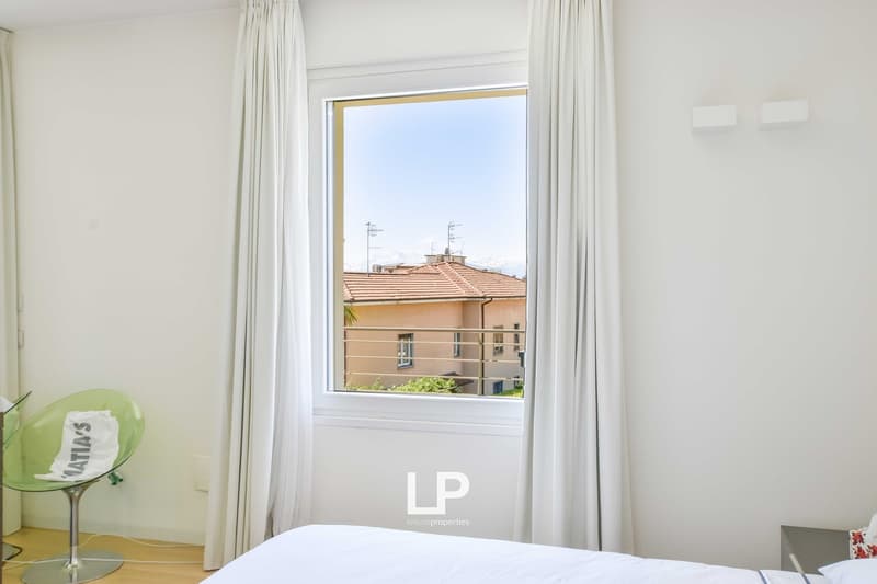 bedroom, bed, nightstand, chair, window, curtains, view of terrace and building
