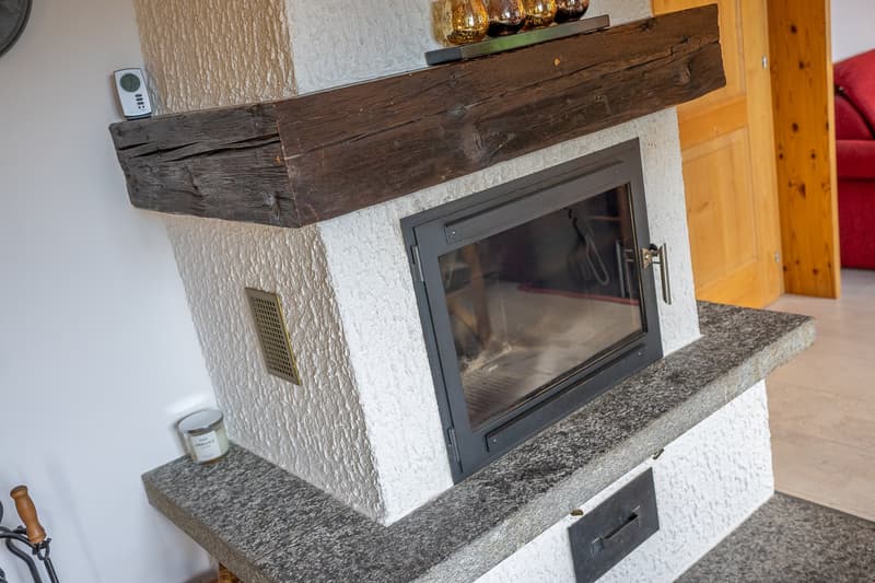 living room, fireplace, white wall, glass window, remote, candle, grey tiled floor, grey tiled bench