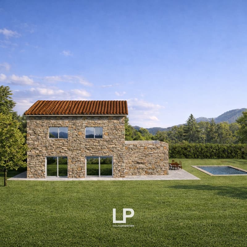 Stone house, red roof, large windows, swimming pool, outdoor dining area, green lawn