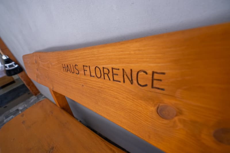 Wooden bench with the text 'HAUS FLORENCE' engraved on it