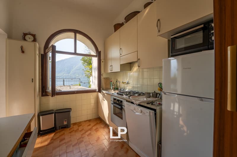 kitchen with a view, white appliances, tiled floor, open window