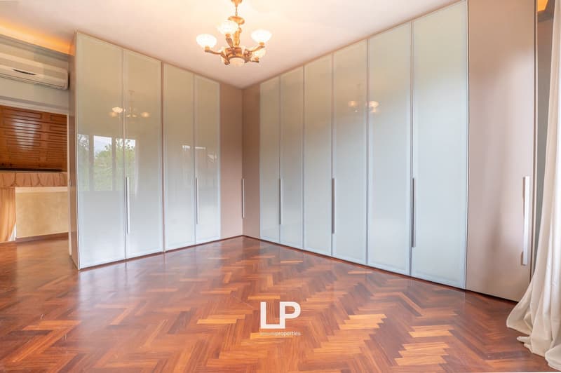 empty room, wooden parquet floor, large glass doors, chandelier, air conditioner