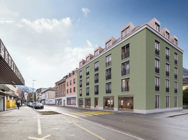 modern 5-storey building, windows, balconies, shops at the bottom floor, entrance with stairs