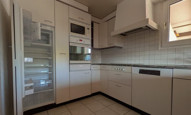 modern kitchen with white cabinets, tiled floor, dishwasher, microwave, oven, refrigerator