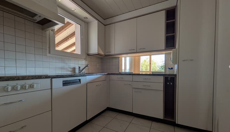 modern kitchen with white cabinets, tiled floor, dishwasher, sink, faucet, window
