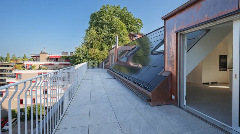Balcony with white railing, tiled floor, solar panels on the wall, glass door