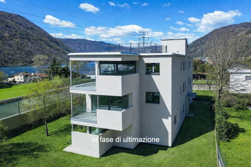 Moderner et nouveau duplex 3.5 pièces avec jardin à Melano (4)
