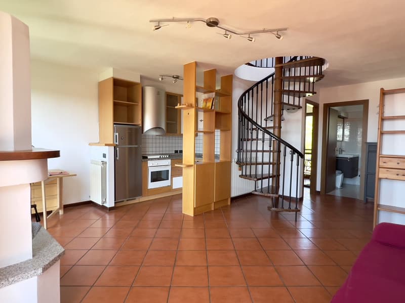 Modern design, fireplace, spiral staircase, kitchen, dining area, tile flooring
