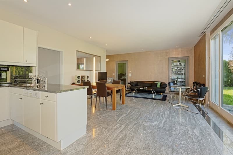 large open kitchen, granite floor, central island, white cabinets, dishwasher, washing machine