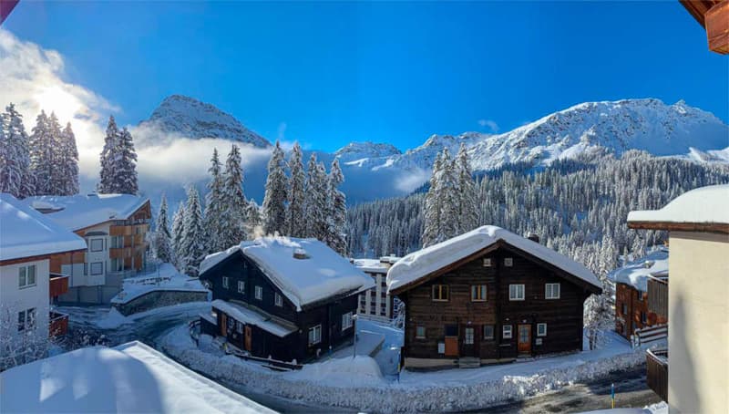 wooden chalets, snow, mountains, pine trees