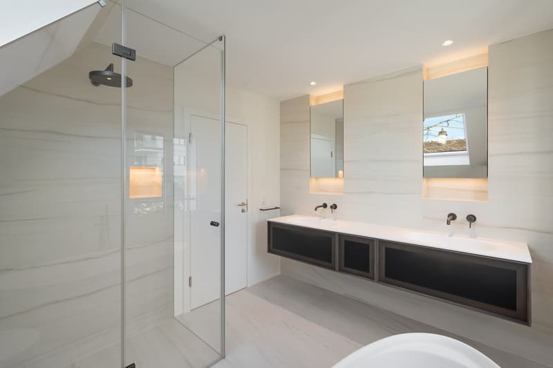 modern bathroom with glass shower, double sink, large mirror, bathtub, marble flooring