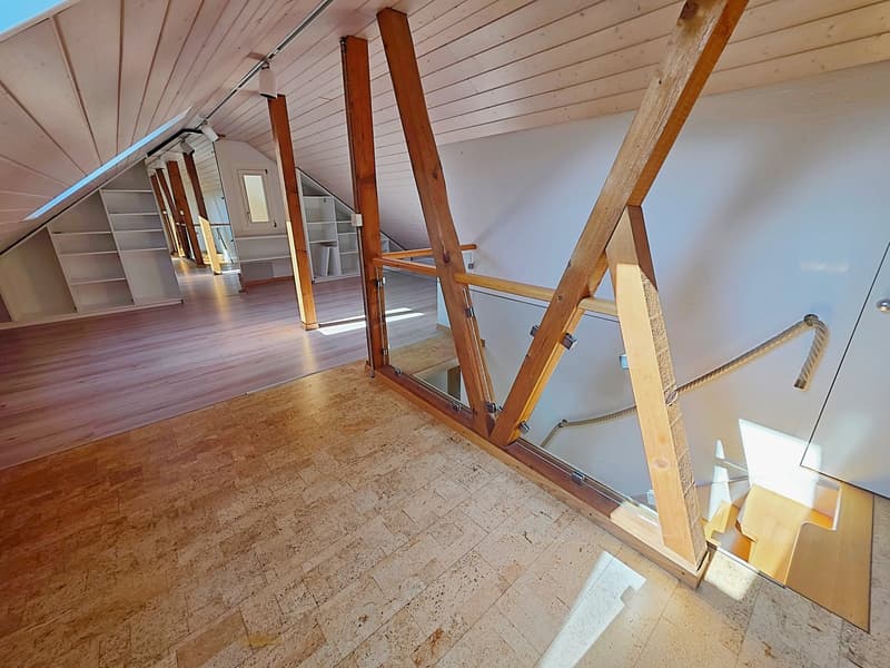 wooden beams, glass railing, wooden floor, white walls, built-in shelves