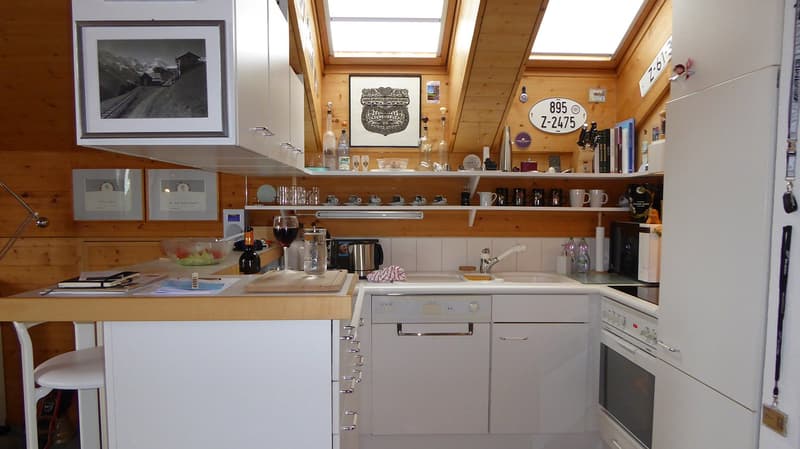 kitchen with white cabinets, white appliances, wooden countertops, open shelves, skylights, wine glasses, framed pictures, books, kitchen utensils