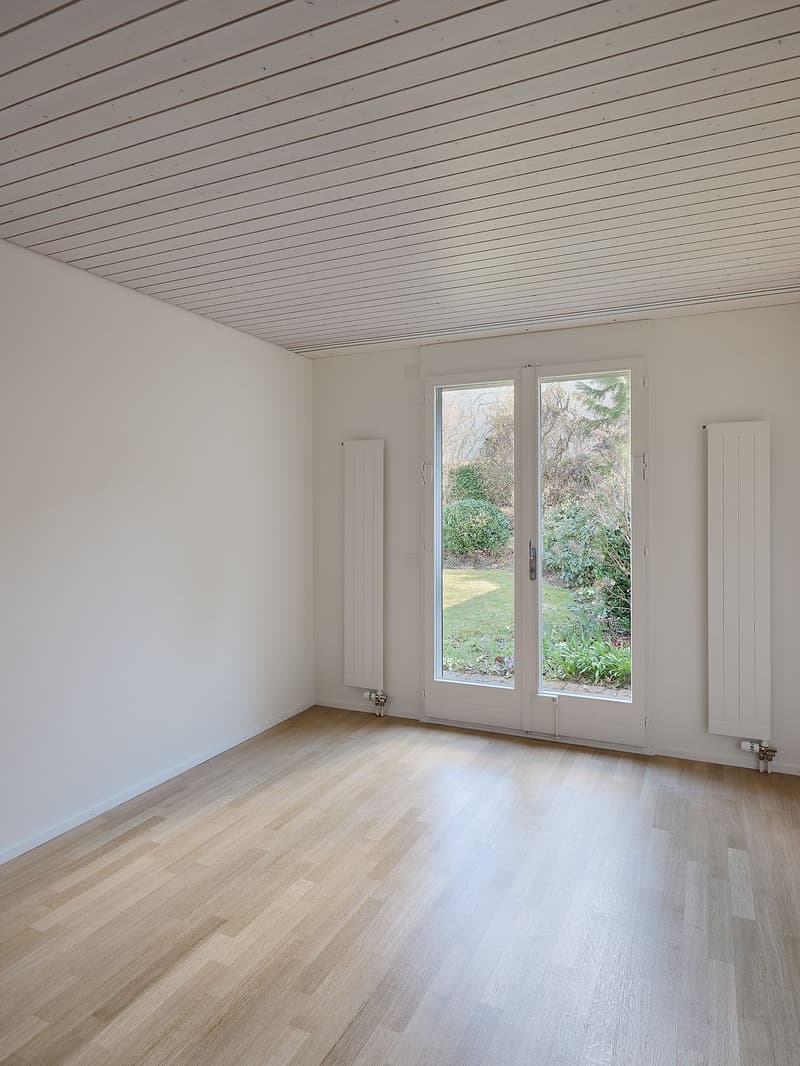 empty room, hardwood floors, sliding glass doors, garden view